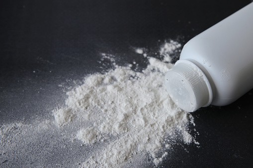 Talcum powder on black background